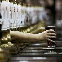 A pint of beer is served through rows of beer pumps at the Campaign For Real Ale Great British Beer Festival at Earls Court in London in this file photo. | REUTERS