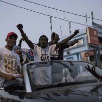 People celebrate the inauguration of new Gambia\'s President Adama Barrow in the Westfield neighborhood on Thursday in Banjul. | AFP-JIJI