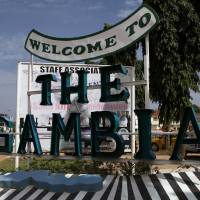 A sign welcoming people to The Gambia is seen at Senegambia in Banjul Saturday. | REUTERS
