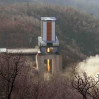 A new engine for a North Korean intercontinental ballistic missile (ICBM) is tested at the Sohae Space Center in Cholsan County, North Pyongan province in this undated photo released in April. | REUTERS