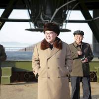 North Korea leader Kim Jong Un smiles as he visits Sohae Space Center in Cholsan County, North Pyongan province, for the testing of a new engine for an intercontinental ballistic missile (ICBM) in this undated photo released in April. | REUTERS
