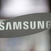 Prosecutors are looking into whether Samsung sought favors from President Park Geun-hye and her friend Choi Soon-sil in return for funding initiatives backed by them. | AP