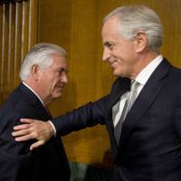 Sen. Bob Corker, R-Tenn., chairman of the Senate Foreign Relations Committee, pats Secretary of State-designate Rex Tillerson on the shoulder after his testimony before the Senate Foreign Relations Committee on Capitol Hill in Washington Wednesday, | AP