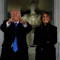 U.S. President-elect Donald Trump and his wife, Melania, take part in a “Make America Great Again” welcome concert at the Lincoln Memorial in Washington Thursday. Trump makes D.C. entrance, plugs 'highest IQ' Cabinet, his hotel before press get the boot
