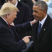 President Donald Trump points at Former President Barack Obama after his speech during the 58th Presidential Inauguration at the U.S. Capitol in Washington Friday. | AP