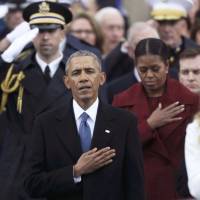 Former president Barack Obama and former first lady Michelle Obama listen as Jackie Evancho sings the U.S. National Anthem during the national anthem during inauguration ceremonies swearing in Donald Trump as the 45th president of the United States on the West front of the U.S. Capitol in Washington Friday. | REUTERS