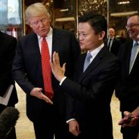 U.S. President-elect Donald Trump and Jack Ma, executive chairman of China\'s Alibaba Group, speak with reporters after their meeting at Trump Tower in New York on Monday. | REUTERS