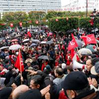 Tunisians demonstrate against the return of jihadis fighting for extremist groups abroad, on Habib Bourguiba Avenue, in Tunis on Sunday. 1,000 Tunisians march against return of jihadis; Libya suspect says journalist pair were executed