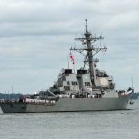 This photo obtained Monday shows the guided-missile destroyer USS Mahan (DDG 72) as it departs Naval Station Norfolk on a deployment to the U.S. 5th Fleet area of responsibility in 2014. The warship fired warning shots over the weekend at four Iranian Revolutionary Guard vessels that approached it at high speed in the Strait of Hormuz, U.S. defense officials said Monday. U.S. destroyer fires warning shots at fast-approaching Iranian attack boats in Strait of Hormuz