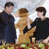 Swiss President Doris Leuthard (right) and Chinese President Xi Jinping raise their glasses for a toast at a gala dinner in Bern on Sunday.  | AP