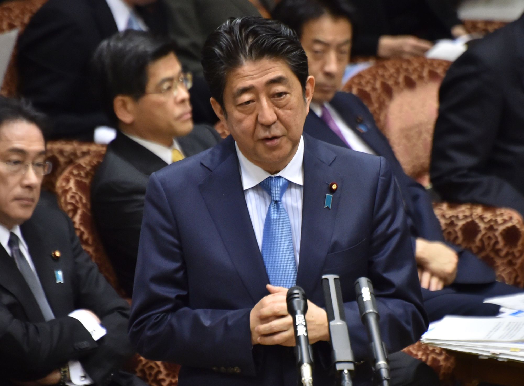 Prime Minister Shinzo Abe answers questions before the Upper House Budget Committee on Monday. | AFP-JIJI