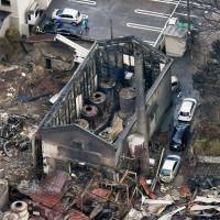 The Kaganoi brewery is in ruins Dec. 23, a day after a major fire gutted several city blocks in Itoigawa, Niigata Prefecture. | KYODO