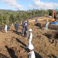 A still image from the documentary \"Takae &#8212; Mori ga Naiteiru 2\" shows construction work at a site for U.S. helipads in Takae, Okinawa, in late October. | &#169;MORINOEIGASHA