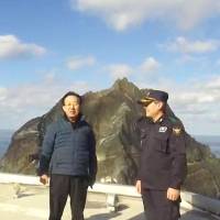 Kim Kwan-yong, governor of North Gyeongsang province, South Korea, posted on his Facebook page Wednesday a photo of himself standing at Takeshima, a pair of islets known as Dokdo in South Korea. South Korean provincial governor visits disputed islets