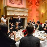 French businesspeople and journalists enjoy a full-course dinner of French dishes infused with Uji green tea at a Paris hotel on Nov. 26. | KYOTO PREFECTURAL GOVERNMENT / VIA KYODO