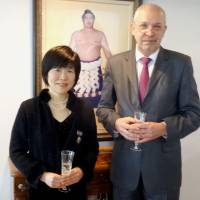 Mari Sasaki (left) poses with Ukraine Ambassador to Japan Ihor Kharchenko at the Ukrainian Embassy in Tokyo on Thursday. | KYODO