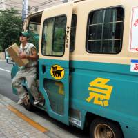 Time is money: Package delivery is a high-stress, low-pay job, and labor shortages are endemic in the industry. | BLOOMBERG