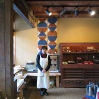 Yoko Kano, 69, stands in her small shop in Katsuyama, Okayama Prefecture on Jan. 3. | J.J. O\'DONOGHUE