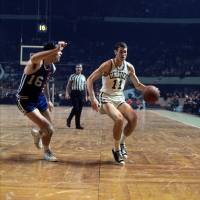 Rookie guard/forward Jim Barnett of the Boston Celtics is seen playing against Jerry Lucas and the Cincinnati Royals during a game in 1967 at the Boston Garden. | NBAE/GETTY IMAGES