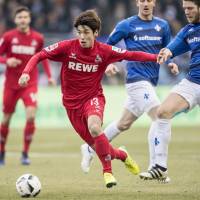 Cologne striker Yuya Osako controls the ball during his team\'s 6-1 win over Darmstadt on Saturday. | KYODO