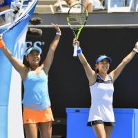Eri Hozumi (left) and Miyu Kato celebrate after defeating Croatia\'s Mirjana Lucic-Baroni and Germany\'s Andrea Petkovic 6-3, 6-3 in the women\'s doubles quarterfinals of the Australian Open on Tuesday. | KYODO