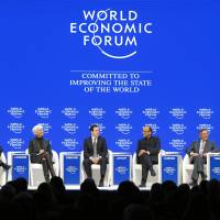 Christine Lagarde, managing director, International Monetary Fund, Haruhiko Kuroda, governor of the Bank of Japan, and others speak during a panel discussion at the annual meeting on Jan. 23, 2016. | WORLD ECONOMIC FORUM/MORTIZ HAGER