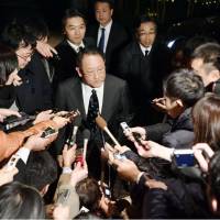 Toyota Motor Corp. President Akio Toyoda fields questions from reporters Friday after a meeting with Prime Minister Shinzo Abe in Tokyo. | KYODO
