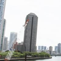 Tower cranes can be seen in Tokyo’s Kachidoki area. Realtors say Tokyo's housing boom fading as sales to Chinese slow