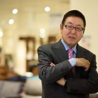 Akio Nitori, chairman and chief executive officer of Nitori Holdings Co., is interviewed at a Nitori Co. store in Tokyo earlier this month. Furniture chain Nitori weighs buying into apparel market