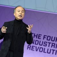 SoftBank boss Masayoshi Son delivers the keynote speech at the Mobile World Congress in Barcelona, Spain, on Monday. | AFP-JIJI