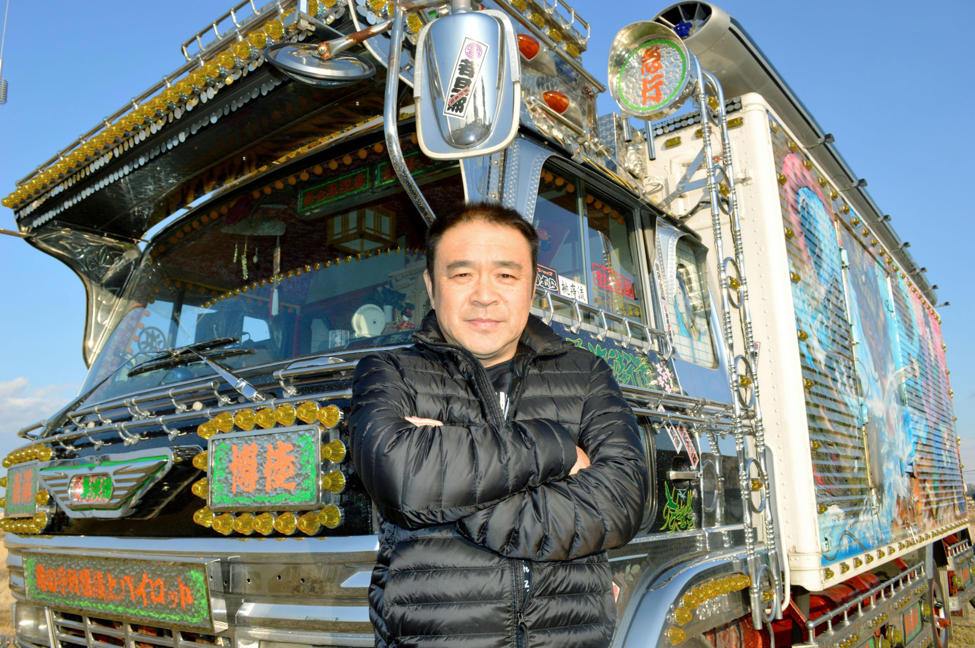Big rig: Kazuya Sekino stands with his dekotora truck in Goka, Ibaraki Prefecture. | KYODO