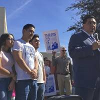 The family of Guadalupe Garcia de Rayos stands behind her attorney, Ray Ybarra Maldonado, as he speaks in front of the U.S. Immigration and Customs Enforcement office in Phoenix, Arizona, Thursday. Garcia de Rayos was deported Thursday after protests. The advocates say she is among the first immigrants to be deported under new policies by President Donald Trump as he cracks down on illegal immigration | AP