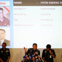 Malaysia\'s Royal Police Chief Khalid Abu Bakar speaks next to a screen showing North Korean Hyon Kwang Song. | REUTERS