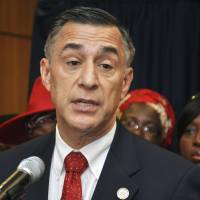 U.S. Rep. Darrell Issa, R-Calif., speaks at a 2015 news conference at the U.S Embassy in Abuja, Nigeria. Issa has called for a special prosecutor to investigate whether Russia interfered in the 2016 presidential election and was in touch with President Donald Trump\'s team during the campaign. Issa says it would be improper for Attorney General Jeff Sessions to lead the investigation. | AP
