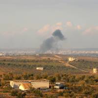 Smoke rises after strikes on rebel-held Deraa city, Syria, Monday. | REUTERS