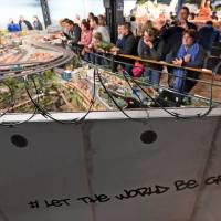 A wall with barbed wire is seen in front of the Las Vegas section at the Miniature Wonderland exhibit in Hamburg, Germany, on Friday. | REUTERS