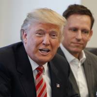 PayPal founder Peter Thiel, who took New Zealand citizenship in 2011, listens on Dec. 14 as President-elect Donald Trump meets with tech leaders at Trump Tower in New York. Rich? Worried about a possible Trumpocalypse? Try New Zealand