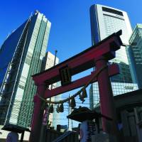 Skyscrapers in the Shiodome district in Minato Ward, Tokyo, tower over 400-year-old Hibiya Shrine on Feb. 20. | SATOKO KAWASAKI