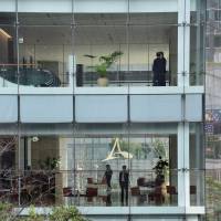 People work in a skyscraper in the Shiodome district in Minato Ward, Tokyo, on Feb. 20. | SATOKO KAWASAKI