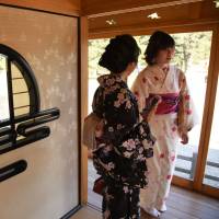 Women in \"yukata\" summer kimono visit a teahouse in Hamarikyu Gardens in Chuo Ward, Tokyo, on Feb. 20. | SATOKO KAWASAKI