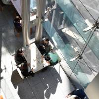 People dine at a restaurant in the Shiodome district in Tokyo’s Minato Ward on Feb. 20. | SATOKO KAWASAKI