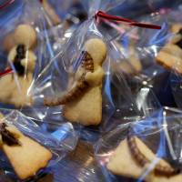 Cookies with insects are put on sale at a bar in Tokyo on Sunday. | REUTERS