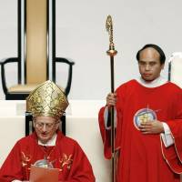 Cardinal Angelo Amato reads out a letter from Pope Francis in a ceremony Tuesday in Osaka to endorse beatification of Japanese Christian warlord Takayama Ukon. | KYODO