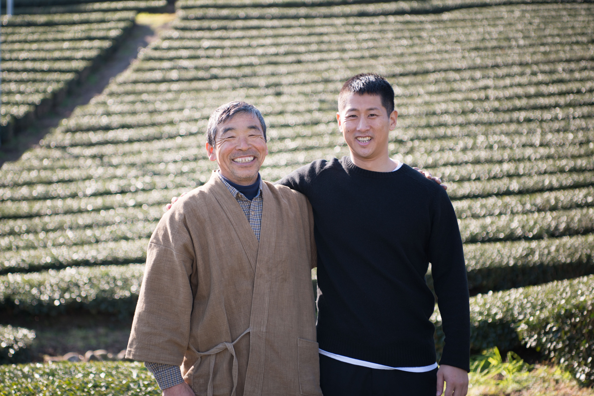 Suil Hong poses with business partner and tea farmer Yoshimitsu Masuda in Shimada, Shizuoka Prefecture. | COURTESY OF SUIL HONG