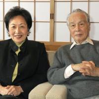 Shumon Miura poses at home with his wife, Ayako Sono, in February 2012. | KYODO