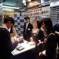 Fans of writer Haruki Murakami line up at Books Kinokuniya\'s main store in Tokyo\'s Shinjuku Ward early Friday to buy the author\'s new title. | DAISUKE KIKUCHI