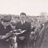 Suyekichi Kinoshita (right) and his wife Akino attend a ceremony at an internment camp in Idaho to commemorate their eldest son, Francis, who died in combat in Europe during World War II. | COURTESY OF TOM IKEDA
