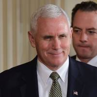 U.S. Vice President Mike Pence (left) and White House Chief of Staff Reince Priebus arrive for a joint press conference at the White House in Washington on Monday. | AFP-JIJI