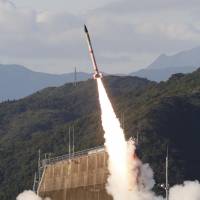 The No. 4 vehicle of the SS-520 series is seen lifting off from the Japan Aerospace Exploration Agency\'s space center in Kagoshima Prefecture on Jan. 15. The agency lost communications with the rocket 20 seconds after liftoff, which it now says may have been caused by an electrical circuit problem. | JAXA / VIA KYODO