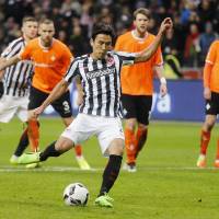 Eintracht Frankfurt\'s Makoto Hasebe scores on a penalty against Darmstadt in Frankfurt on Sunday. | AP